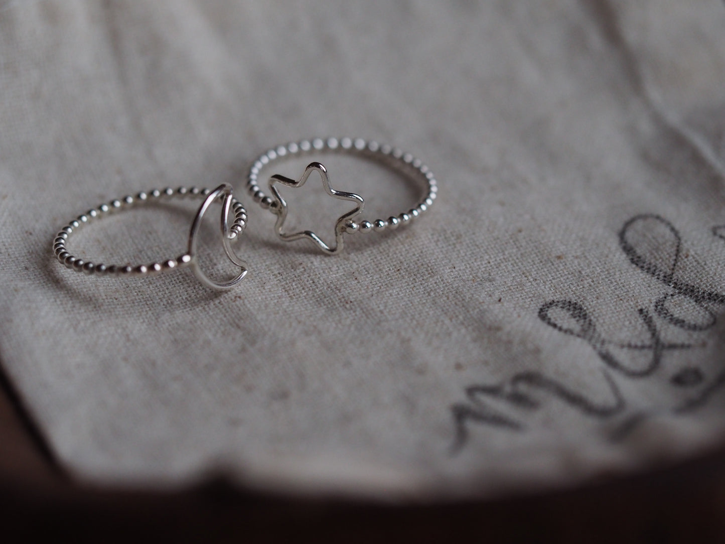 silver beaded rings with moon and star detail