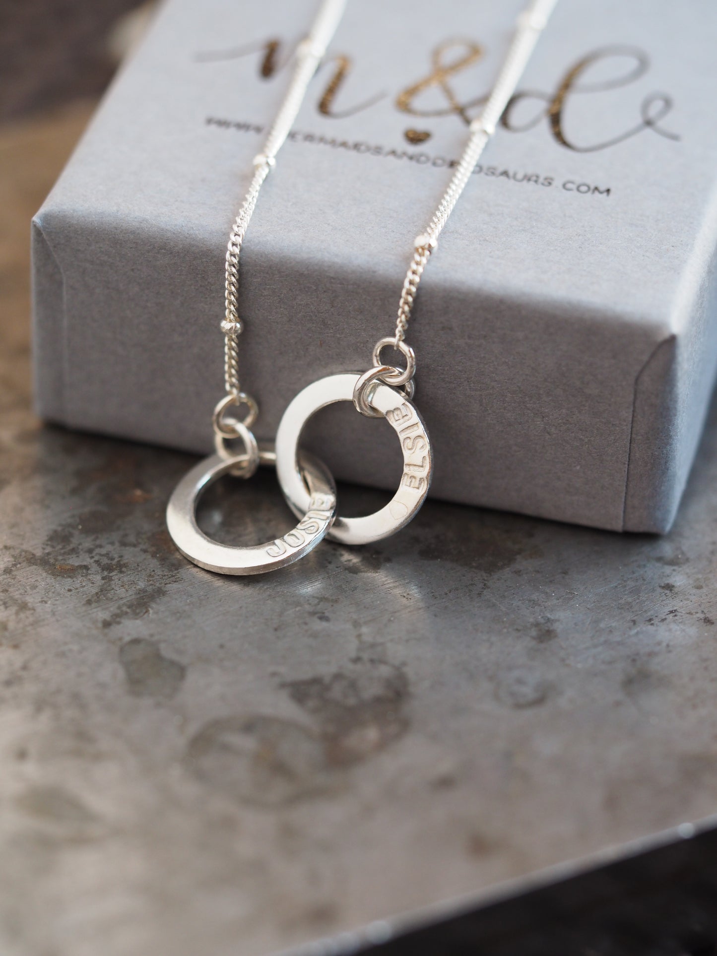 Collier mini rondelle entrelacé en argent