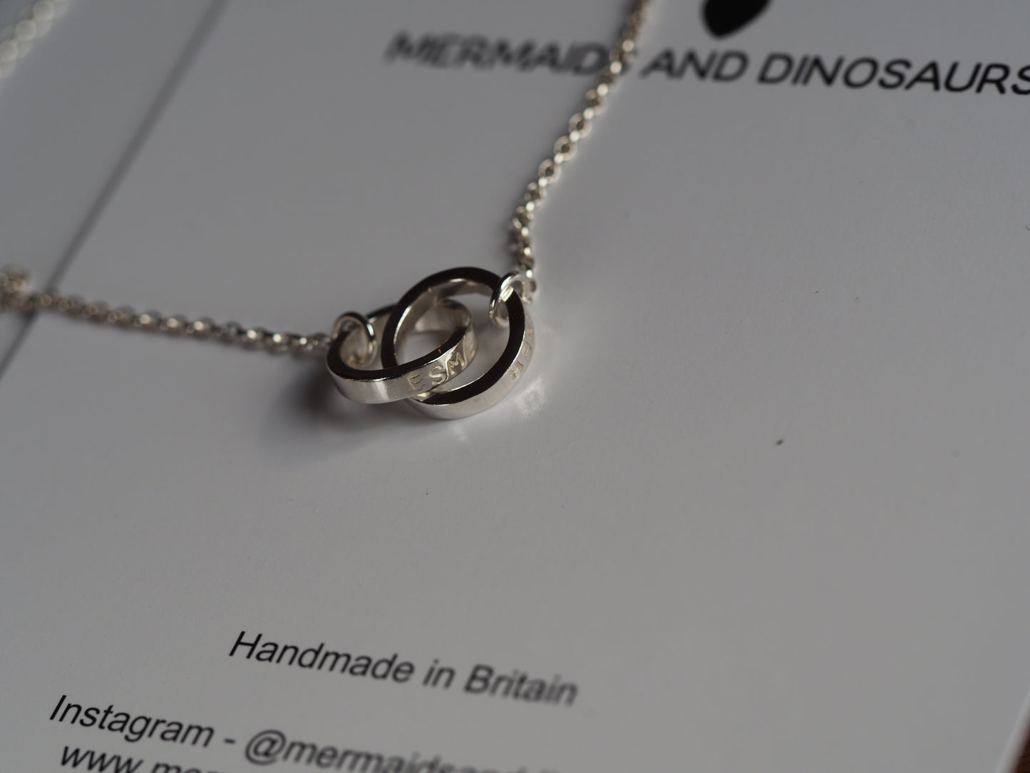 interlocking ring necklace displayed on a M&D card - handmade in britain