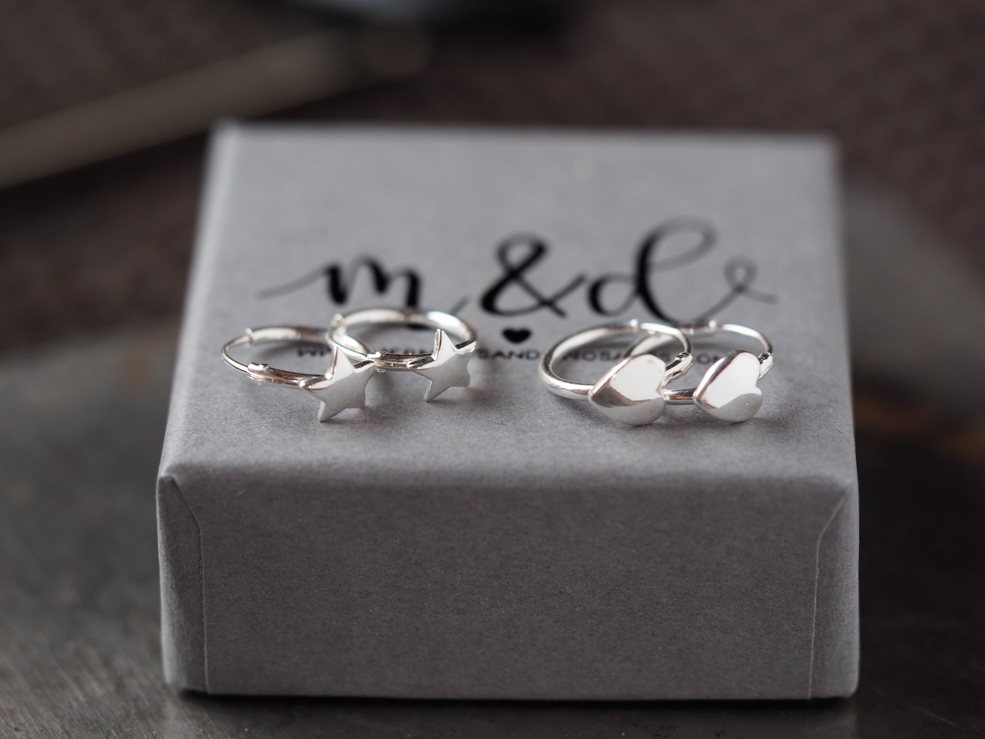 Silver rings on a branded jewelry box