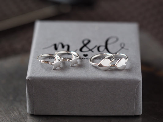 Silver rings on a branded jewelry box